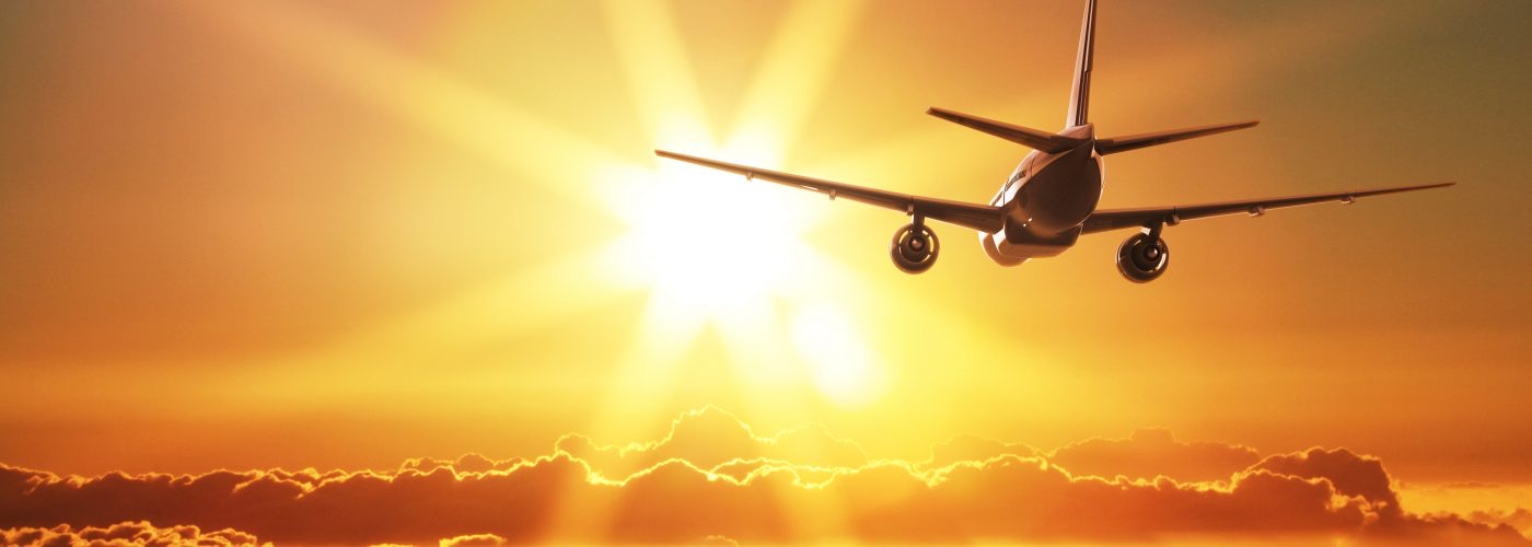 Aircraft flying at sunset